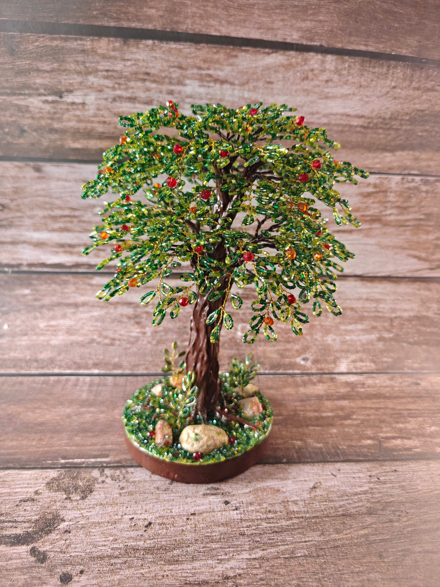 Green tree with red and orange fruits