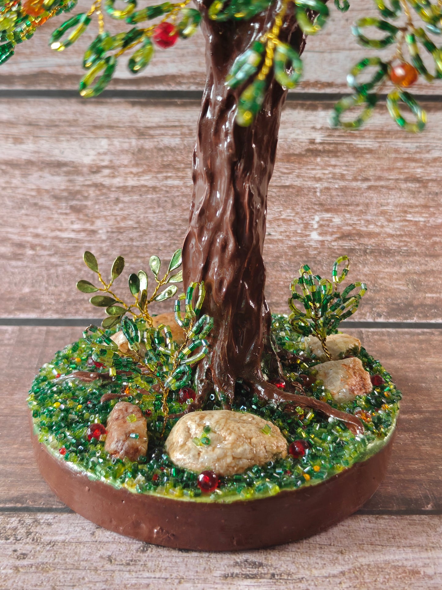 Green tree with red and orange fruits