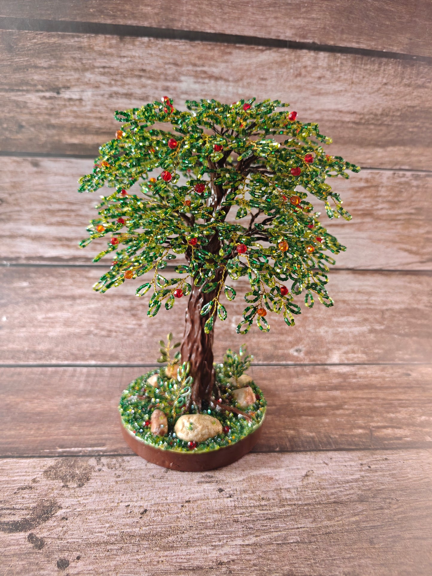 Green tree with red and orange fruits