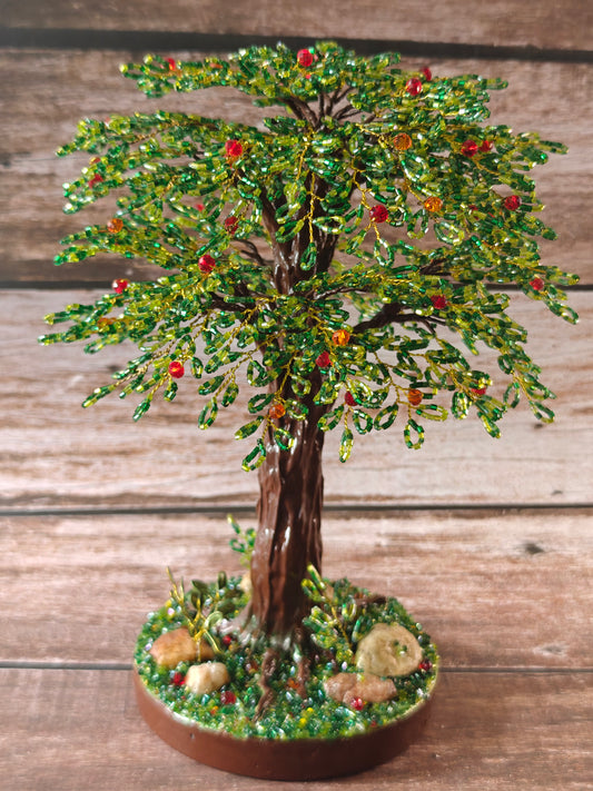 Green tree with red and orange fruits